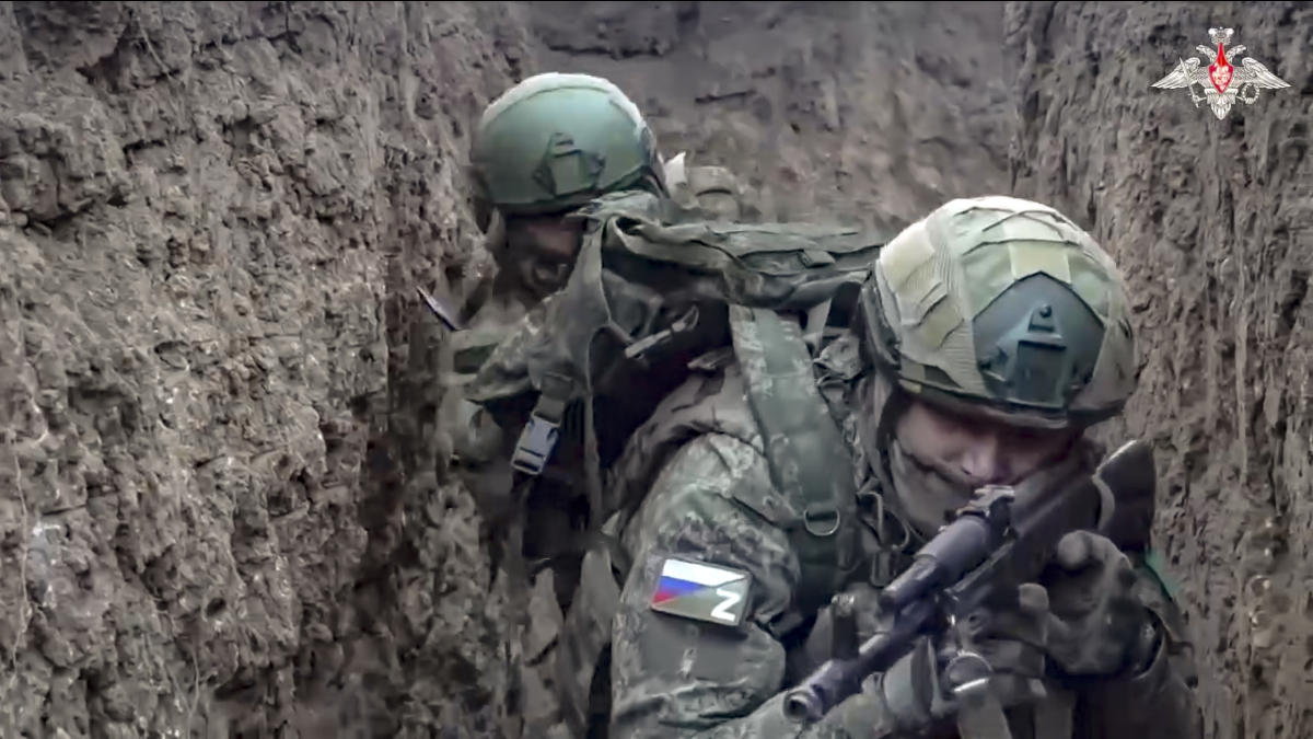 Above, Russian servicemen attend a combat training for assault units in an undisclosed location. (Russian Defense Ministry Press Service via AP)