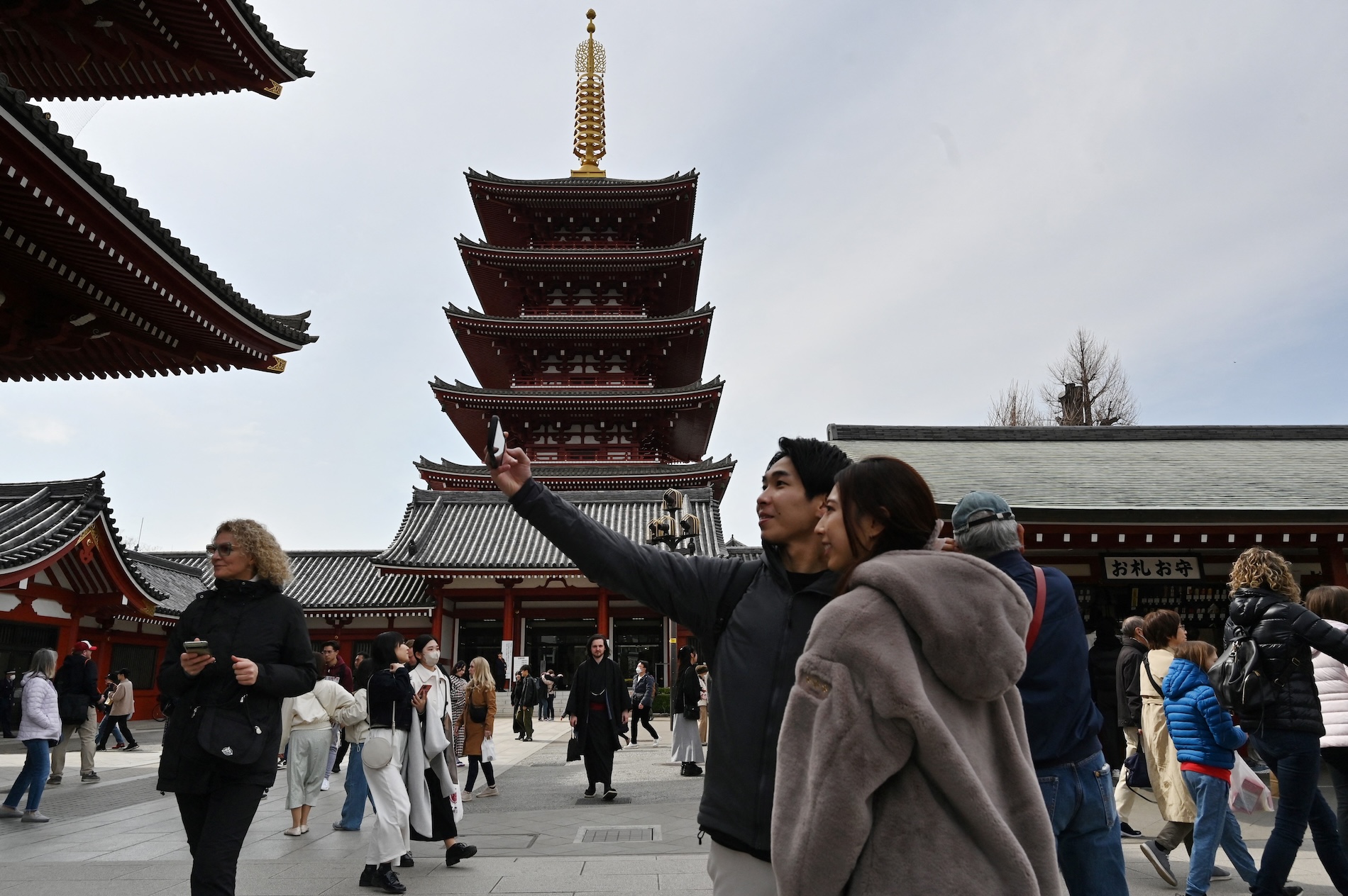 People visit Sensoji Temple in Tokyo on March 19, 2024. (AFP)