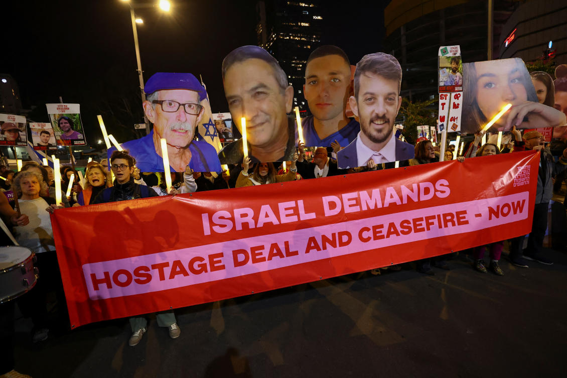 People hold cutouts of images of hostages during a protest against the government and to show support for the hostages who were kidnapped during the deadly October 7, 2023 attack, amid the ongoing conflict in Gaza between Israel and Hamas, in Tel Aviv, Israel January 4, 2025. (REUTERS)