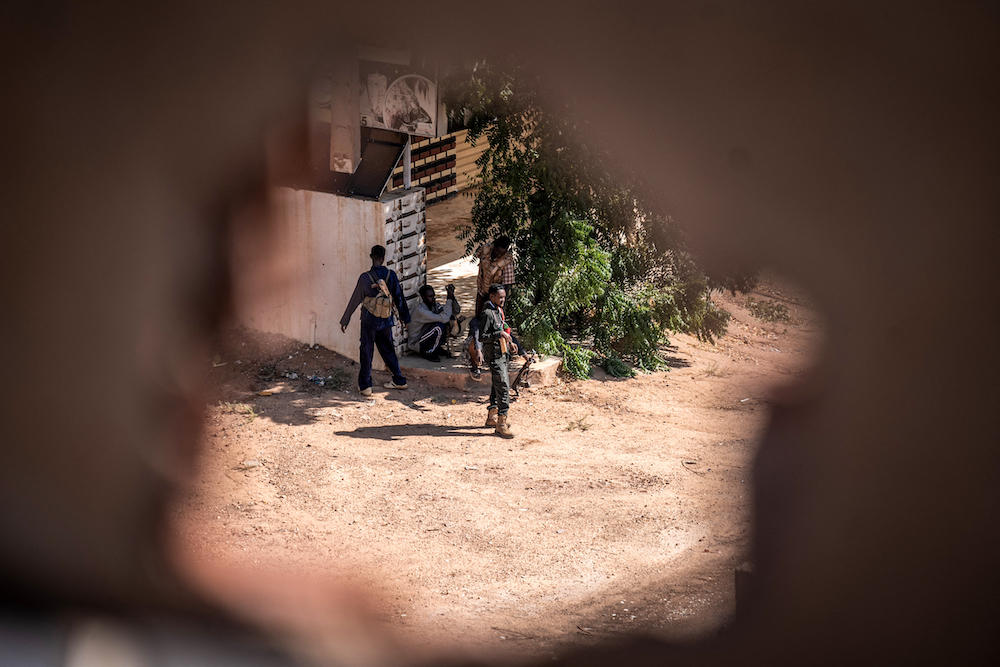 Khartoum has experienced some of the war’s worst violence, with entire neighborhoods emptied out and taken over by fighters. Above, army soldiers take cover along the frontline in Khartoum North on Nov. 3, 2024. (AFP)