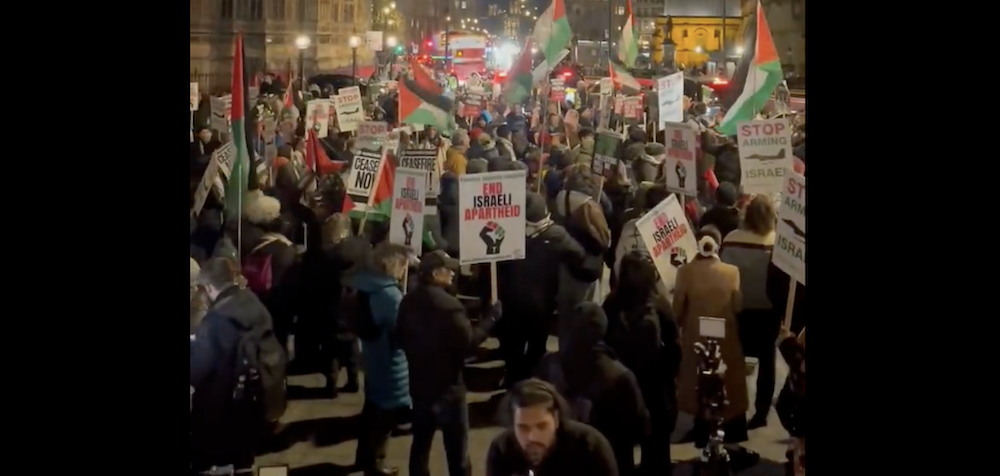 An emergency demonstration organized by the Palestine Solidarity Campaign and its partners took place opposite the UK Parliament buildings in London on Monday. (Screenshot/PSC)