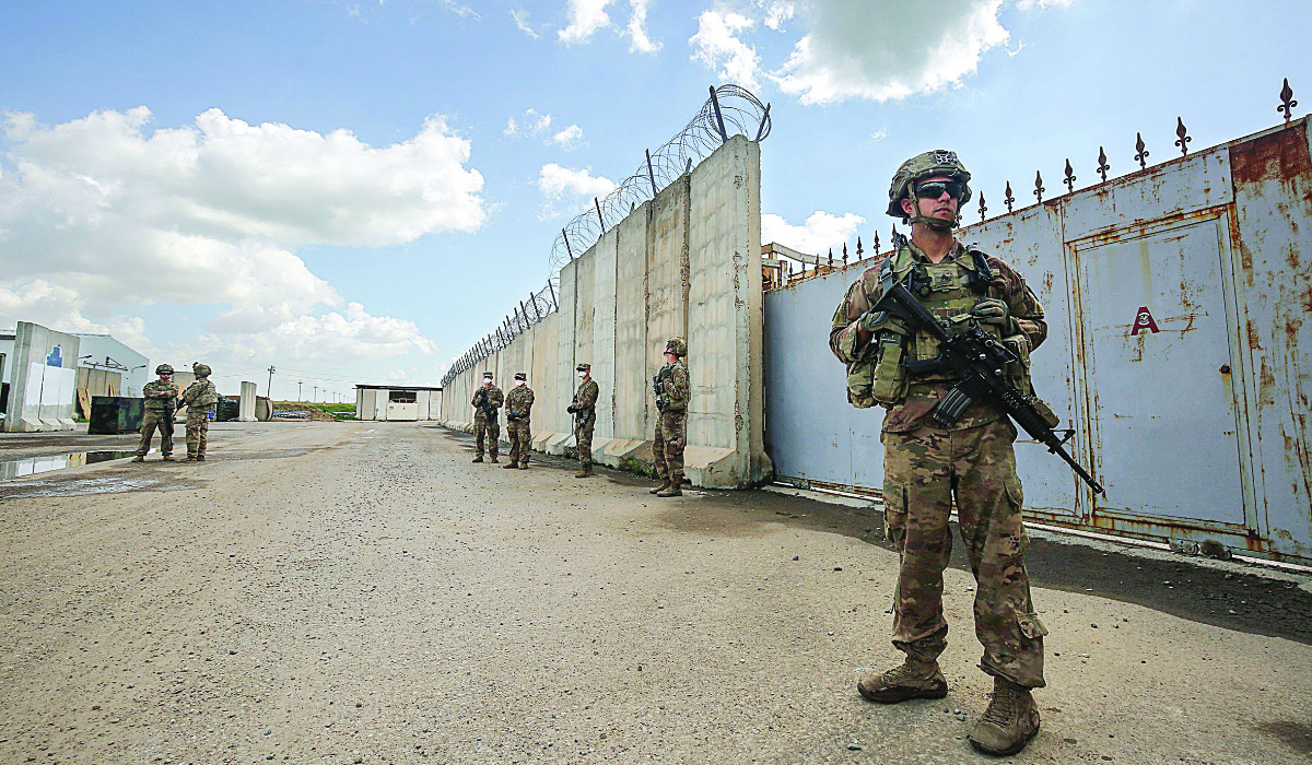 US army soldiers stand on duty at the K1 airbase northwest of Kirkuk in northern Iraq on March 29, 2020. (AFP)