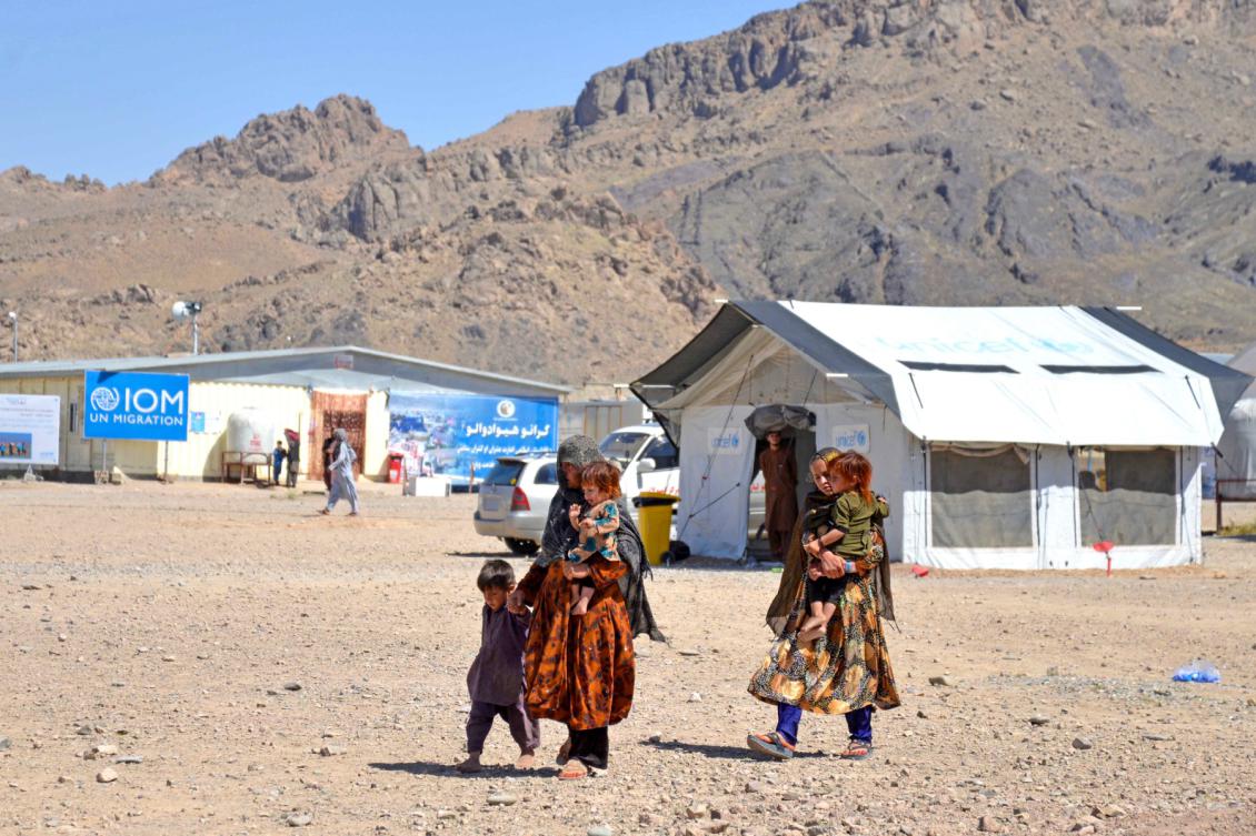 Afghan refugees walk at a registration centre upon their arrival from Pakistan in Takhta Pul district of Kandahar province on May 22, 2024. (File/AFP)
