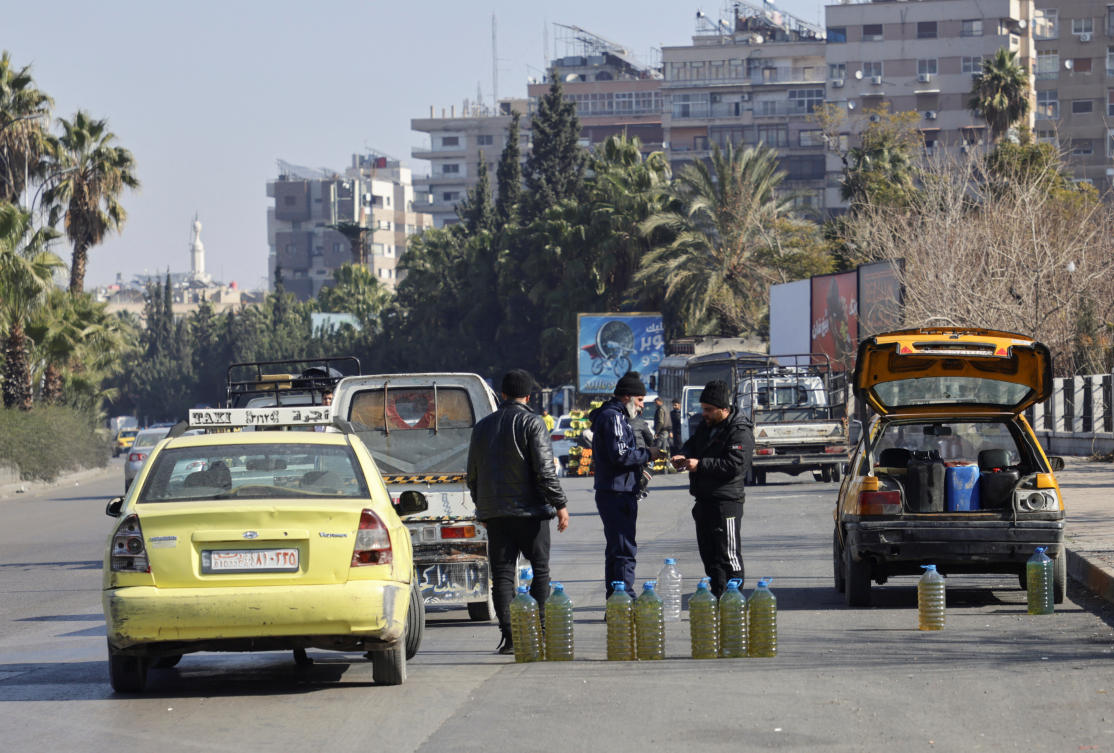 A street vendor sells diesel and gasoline along a street after the ousting of Syria's Bashar al-Assad, in Damascus, Syria, January 7, 2025. (Reuters)