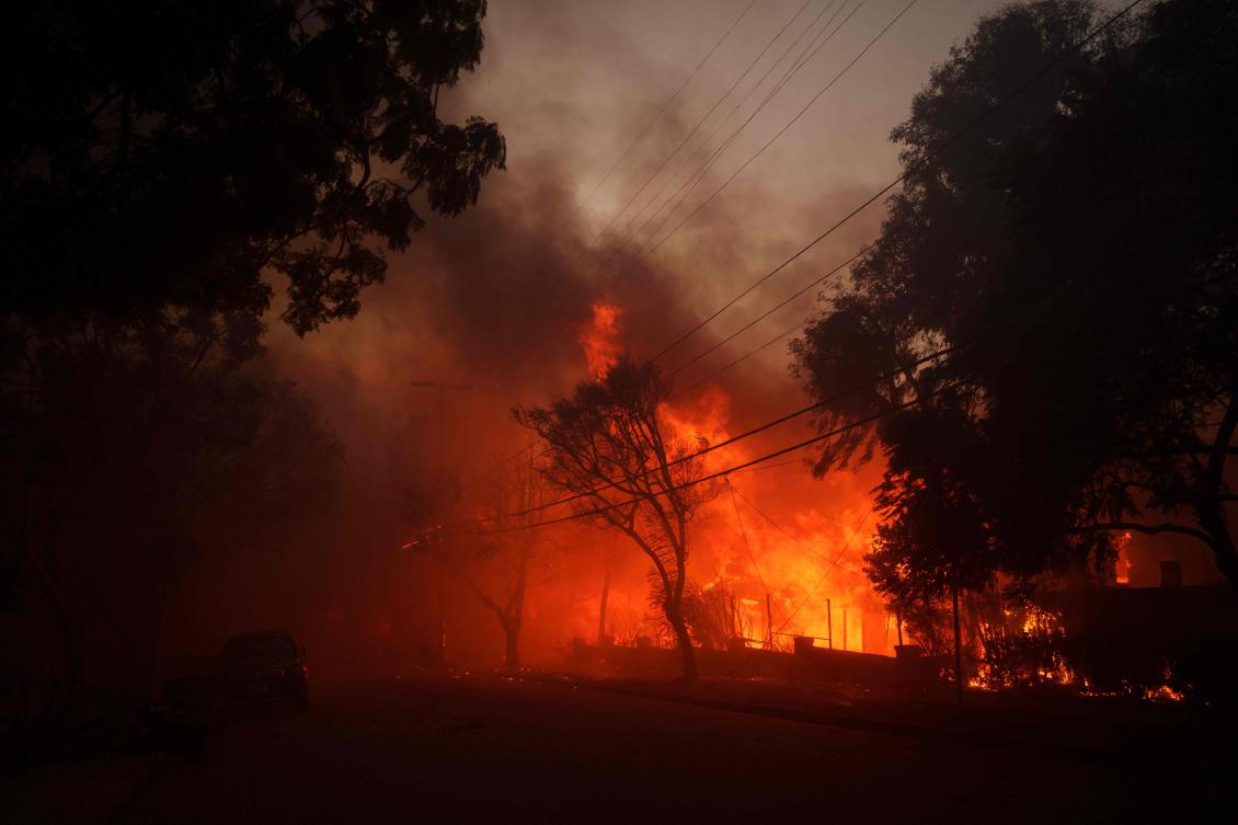 Flames from the Palisades Fire burn a home on January 7, 2025 in the Pacific Palisades neighborhood of Los Angeles, California. (AFP/ Getty Images via AFP)
