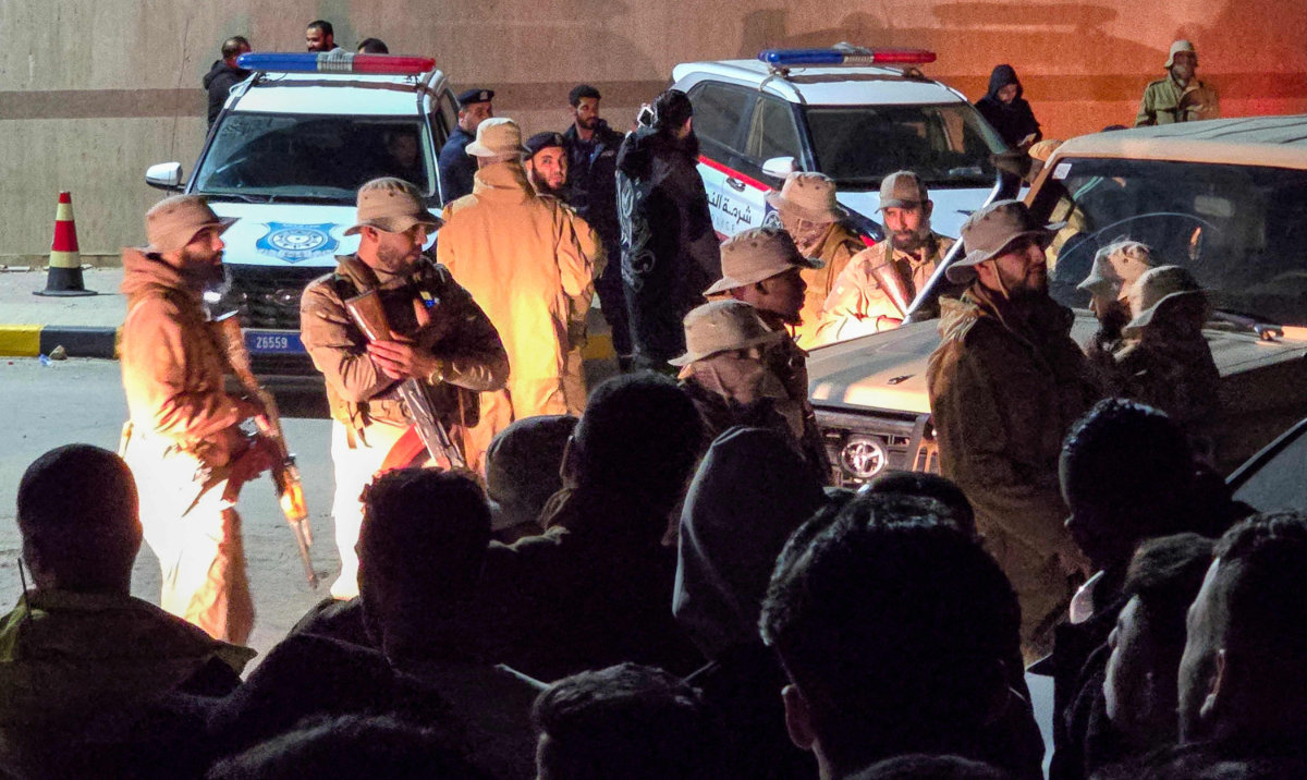 Security forces deploy as protesters gather outside the residence of the Tripoli-based Libyan Government of National Unity Prime Minister Abdulhamid Dbeibah early on Tuesday. (AFP)