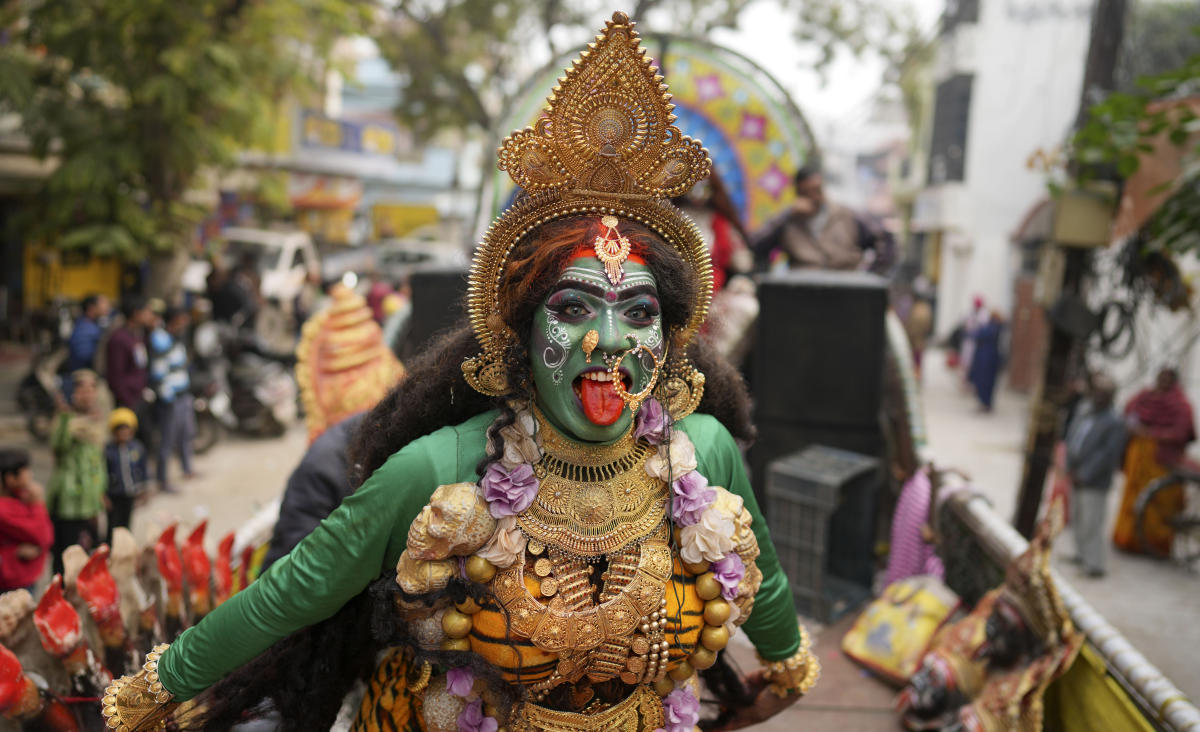 Thousands of devotees stampeded outside The Sri Venkateswara Swamy Temple, one of the most visited Hindu temples, while in queue to collect tokens for a free visit to the deity. Above, an Indian man dressed as Hindu goddess Kali dances during Shri Anand Akhara Panchayati participate in a procession toward the Sangam, the confluence of rivers Ganges and Yamuna on Jan. 6, 2025. (AP)