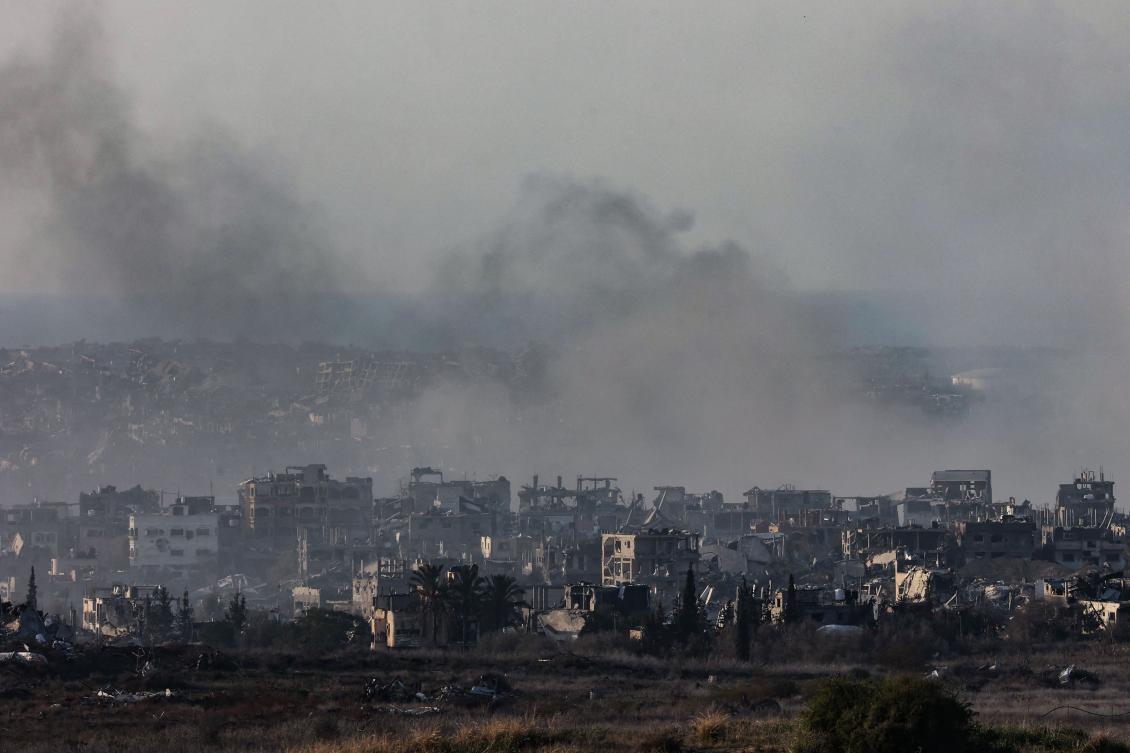 This picture taken from southern Israel shows smoke rising above destroyed buildings in the northern Gaza Strip during Israeli bombardment on January 8, 2025, amid the ongoing war between Israel and the Palestinian militant group Hamas. (AFP)
