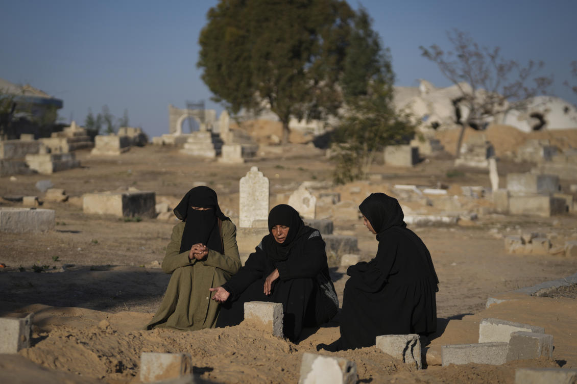 Fatma Abu Awad and her daughter Malak pray in a graveyard where their relatives who were killed by an Israeli airstrike are buried, in Khan Younis, Gaza, Jan. 9, 2025. (AP)