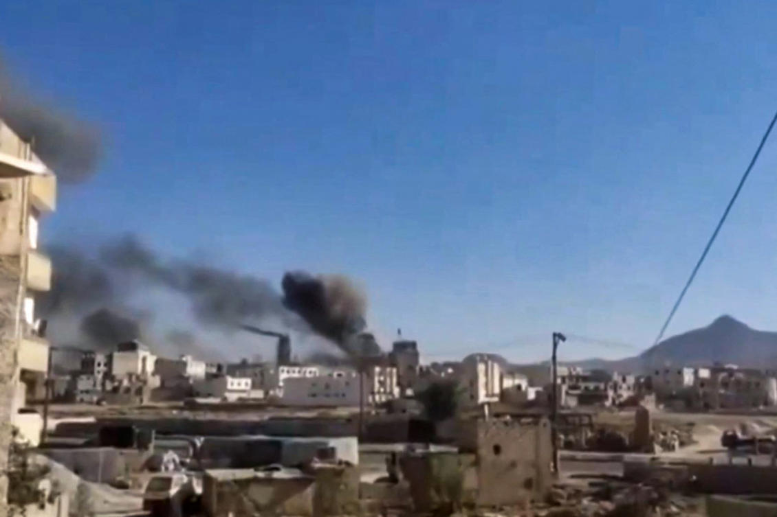 This image grab from a UGC video posted on social media on Jan. 10, 2025, shows smoke billowing during reported Israeli airstrikes in Yemen’s Houthi-controlled capital Sanaa. (AFP)