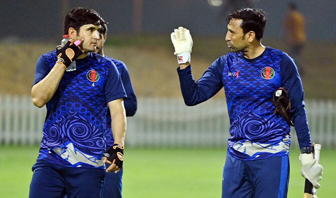 This handout photo, released by the Afghanistan Cricket Board on January 8, 2025, shows Pakistan’s Younis Khan (right) during a practice session in Dubai on April 7, 2022. Afghanistan hire Younis Khan as mentor for Champions Trophy, according to the Afghan cricket board. (ACB)