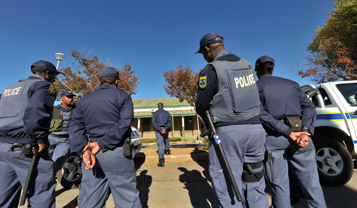 South African police patrol stand guard on the street in Ventersdorp. (AFP file photo)