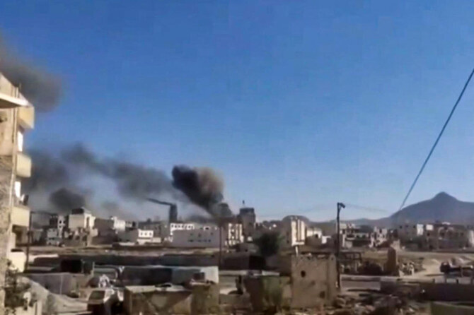 This image grab from a UGC video posted on social media on Jan. 10, 2025, shows smoke billowing during reported Israeli airstrikes in Yemen’s Houthi-controlled capital Sanaa. (AFP)