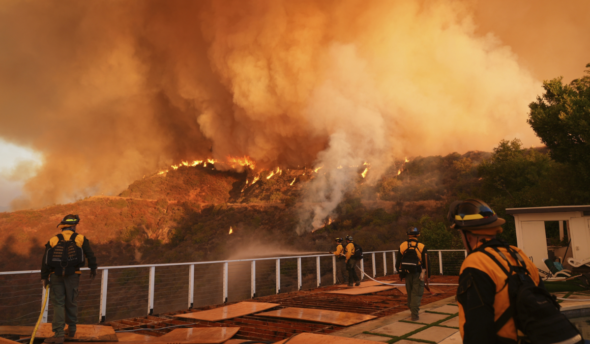 Fire crews monitor the Palisades Fire in Mandeville Canyon on Saturday, Jan. 11, 2025, in Los Angeles. (AP)