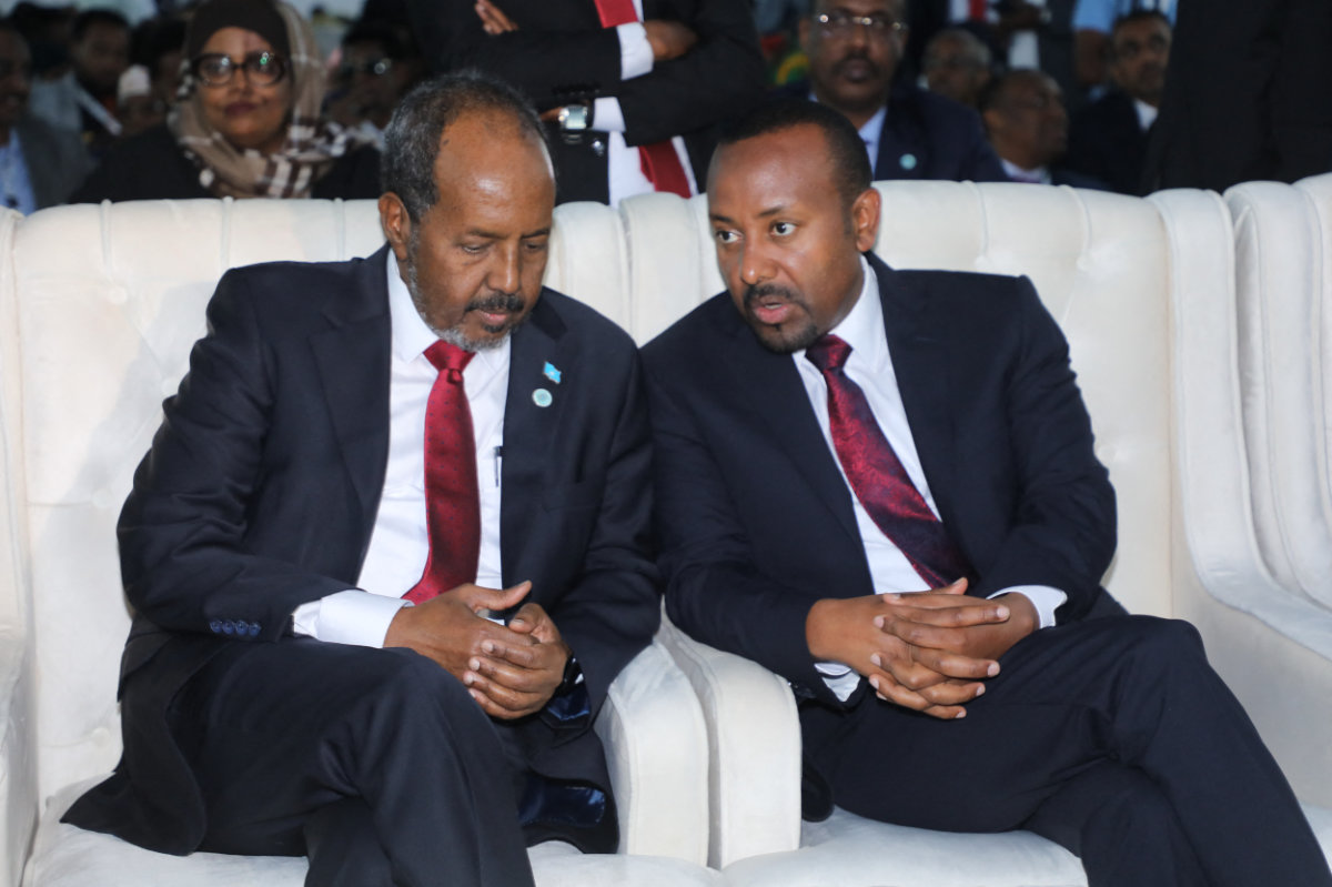 This photo taken on June 9, 2022, shows Hassan Sheikh Mohamud (L) speaking with Ethiopia's Prime Minister Abiy Ahmed during Hassan's inauguration ceremony as Somalia's 10th president in Mogadishu. (AFP)