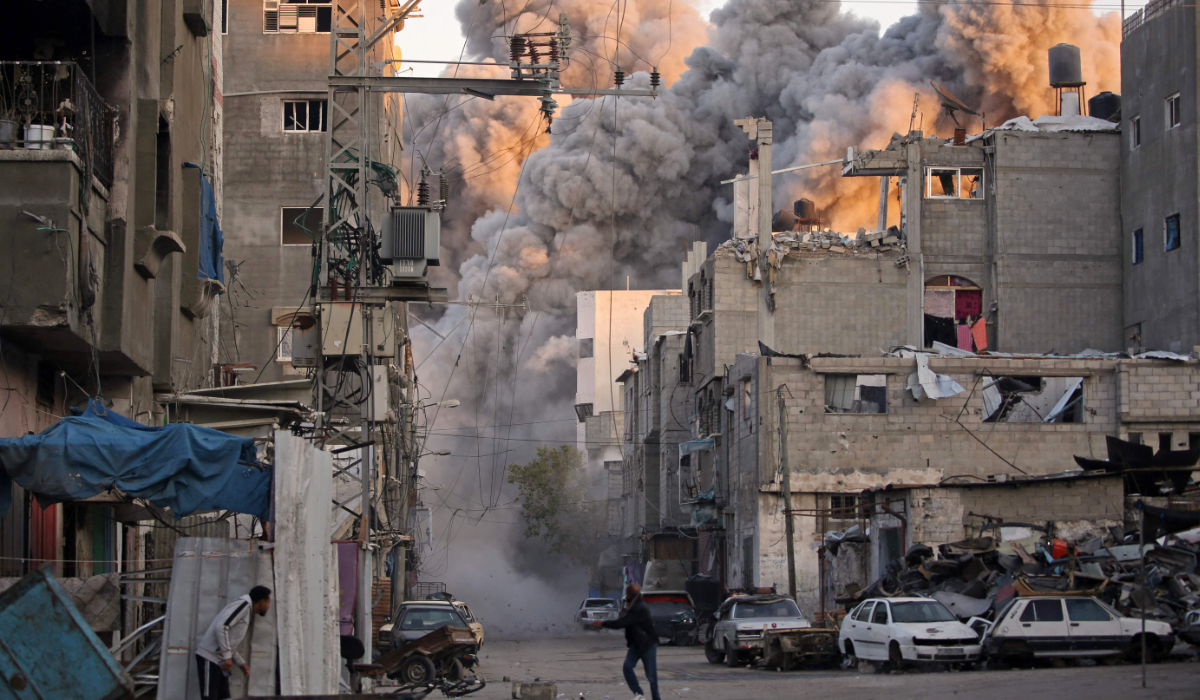 Smoke rises from a building destroyed in Israeli airstrike at the Bureij camp for Palestinian refugees in the central Gaza Strip on January 12, 2025, as the war between Israel and Hamas militants continues. (AFP)