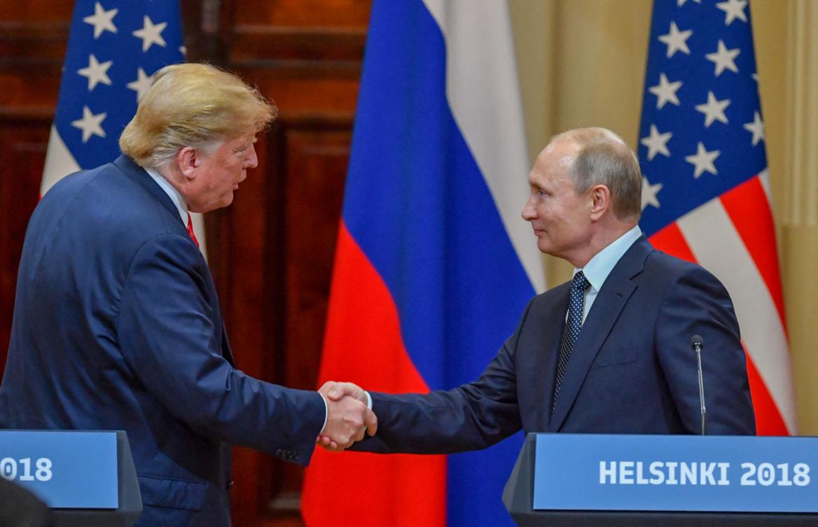 Donald Trump and Vladimir Putin shake hands in Helsinki, on July 16, 2018. (AFP)