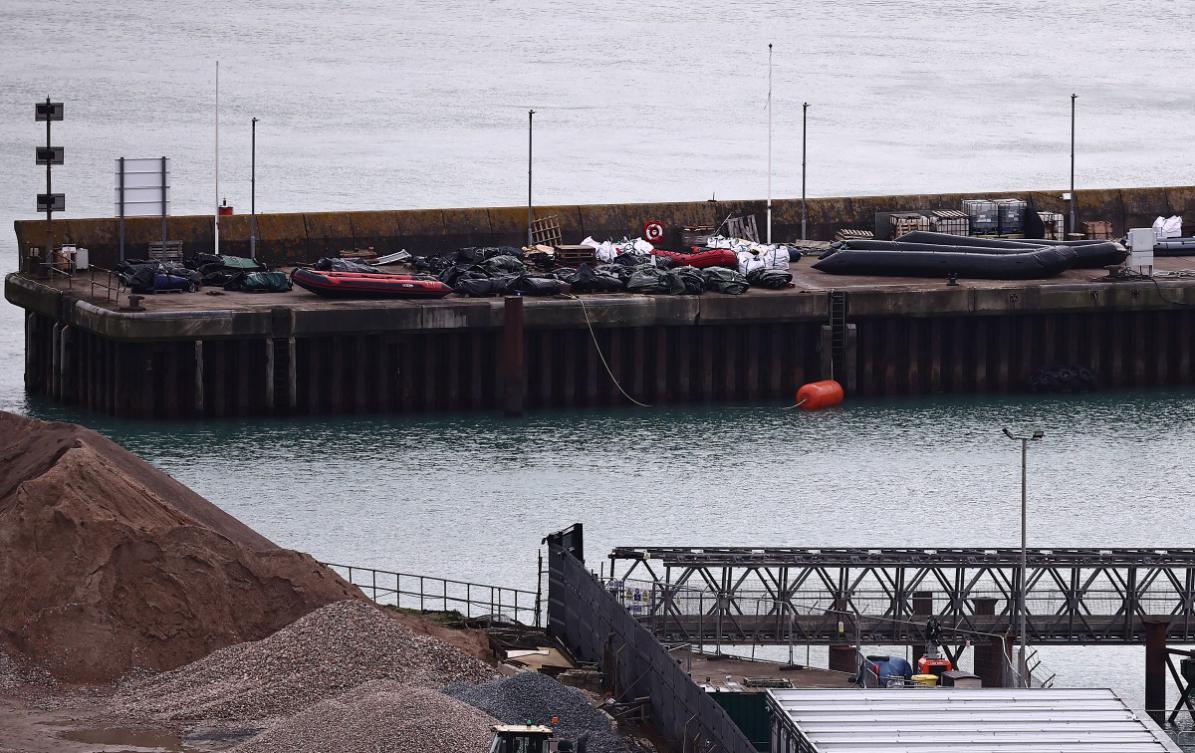 Inflatable dinghies used by migrants on previous attempted crossings of the English Channel from france to England, are pictured stored on the quayside at the harbour at the Port of Dover, on the southeast coast of England on December 30, 2024. (File/AFP)