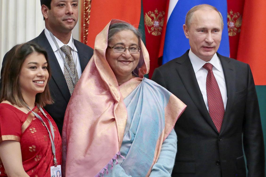 Russian President Vladimir Putin, right, ousted Bangladesh Prime Minister Sheikh Hasina, second right, and Tulip Siddiq, left, attend a ceremony in the Kremlin in Moscow, Russia. (File/AP)