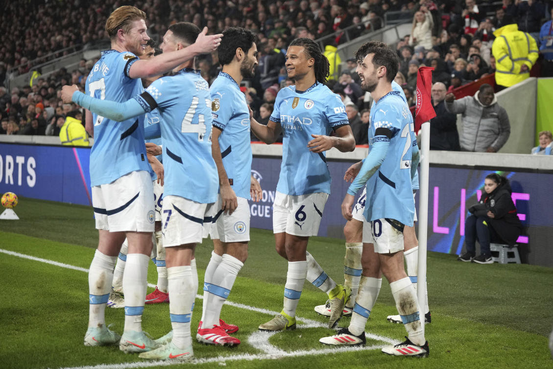Manchester City’s players celebrate a goal from they teammate Phil Foden scoring the second goal against Brentford during their English Premier League match at the Gtech Community stadium, in London, Jan. 14, 2025. (AP)