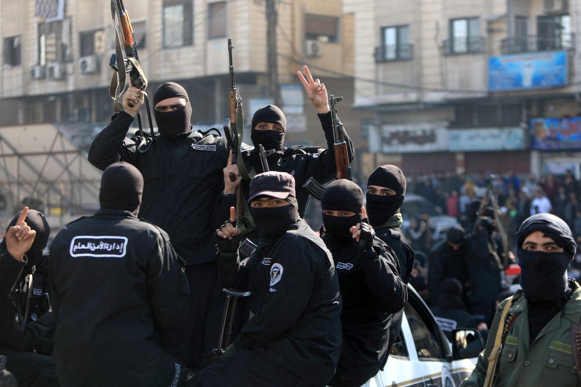 Security forces reporting to Syria’s transitional government patrol the streets of Dummar, a suburb of the Syrian captial Damascus, during an operation to seize weapons and hunt down armed supporters of the ousted Assad leadership on January 15, 2025. (AFP)