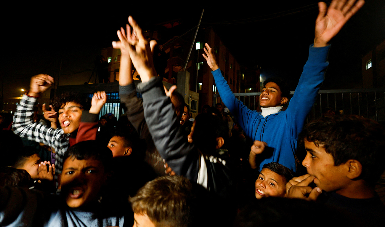 Palestinians react as they wait for news of a ceasefire deal with Israel, in Khan Younis in the southern Gaza Strip on January 15, 2025. (REUTERS)