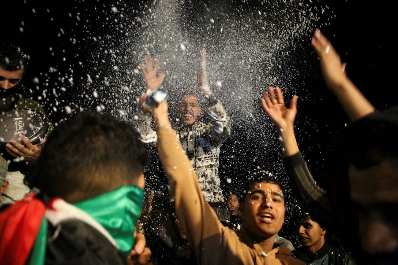 Palestinians react to news on a ceasefire deal with Israel, in Khan Younis in the southern Gaza Strip, January 15, 2025. (Reuters)