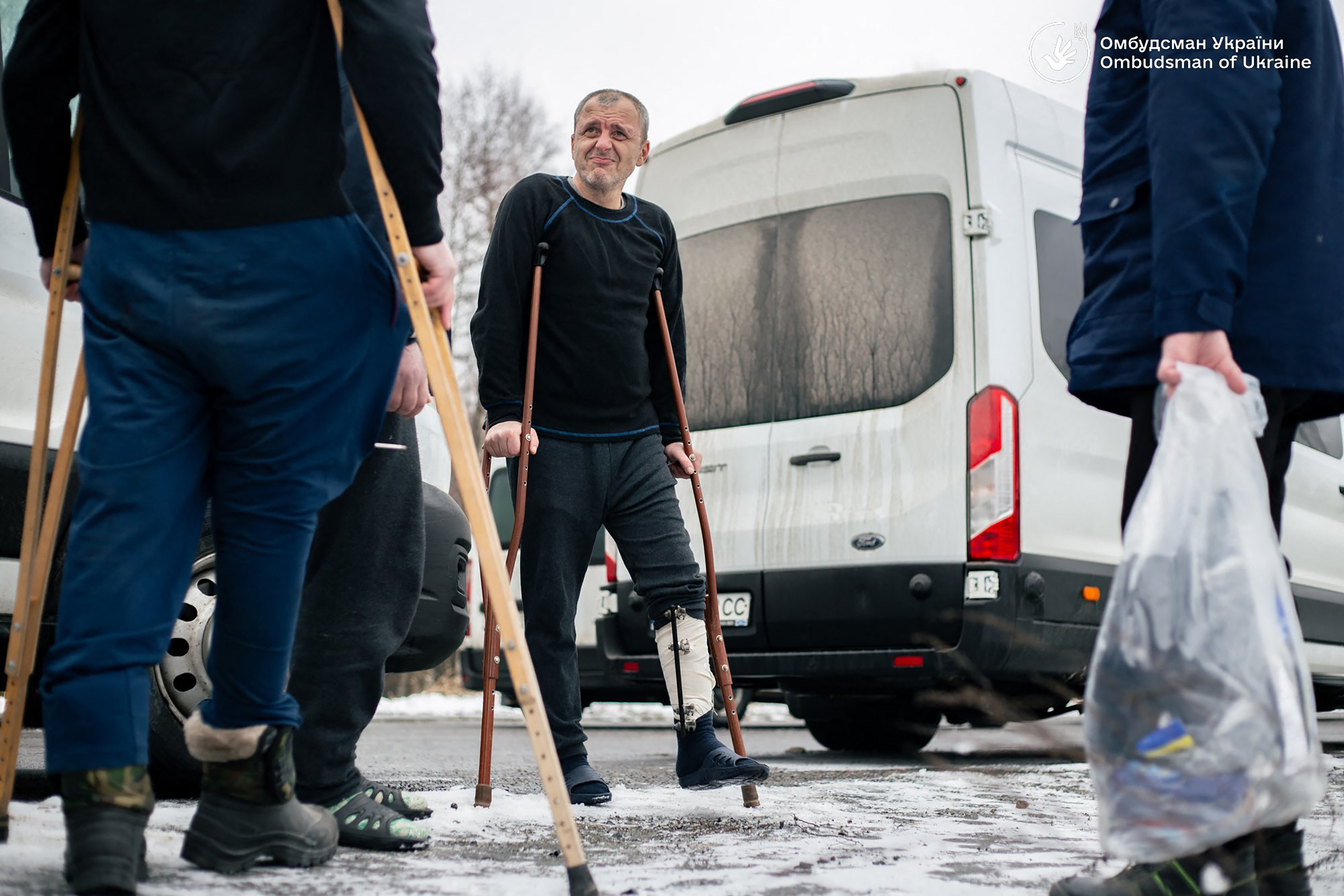 Ukrainian former prisoners of war following a swap, at an undisclosed location in Ukraine, on Jan. 15, amid the Russian invasion of Ukraine (AFP/X ACCOUNT: @LUBINETZS)