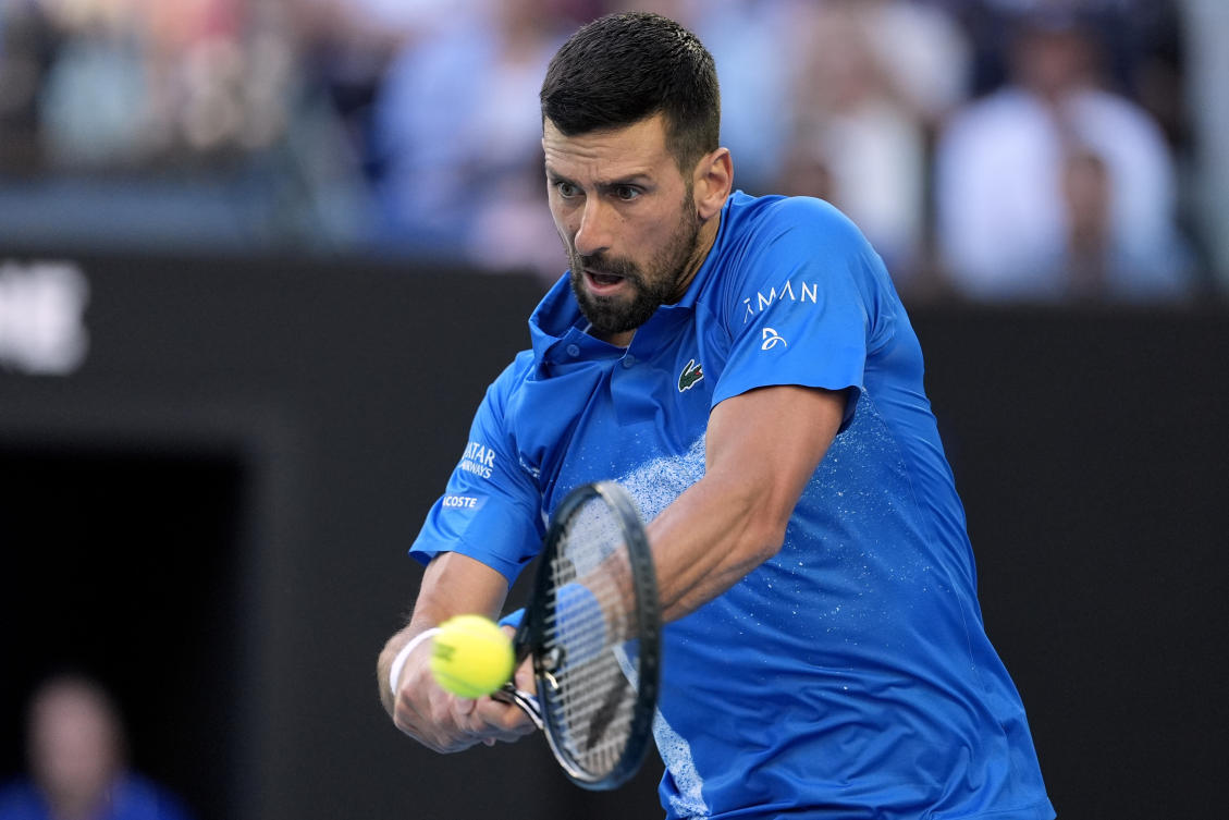 Novak Djokovic of Serbia plays a backhand return to Tomas Machac of the Czech Republic during their third round match at the Australian Open tennis championship in Melbourne, Jan. 17, 2025. (AP)