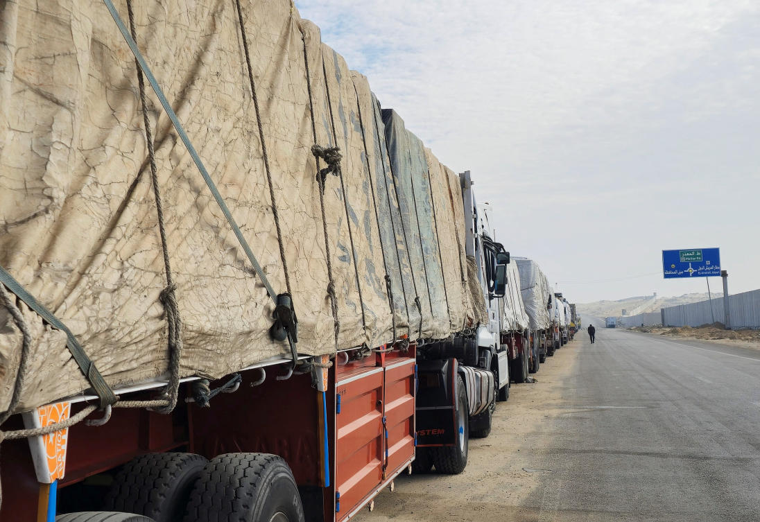 Trucks carrying aid line up near the Rafah border, waiting to cross into the Gaza Strip, following the announcement of a ceasefire agreement between Israel and Hamas, in Al Arish, Egypt, Jan. 16, 2025. (Reuters)