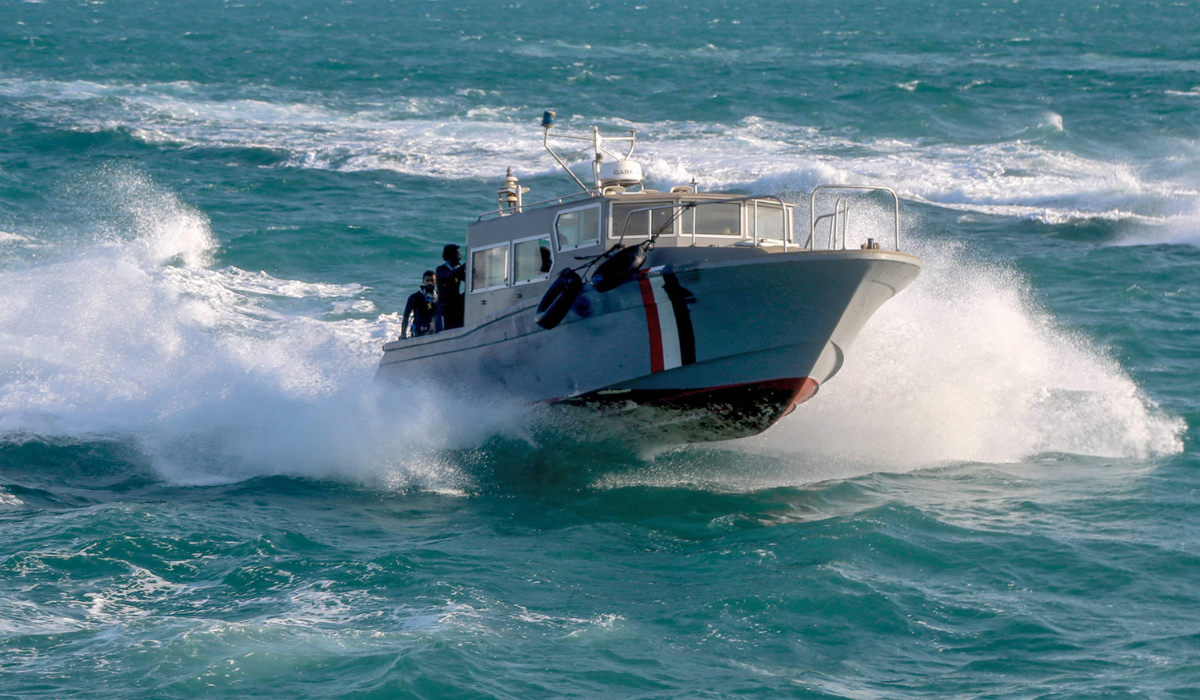 Yemeni coastguard members loyal to the internationally-recognised government ride in a speedboat cruising in the Red Sea off of the government-held town of Mokha in the western Taiz province, close to the strategic Bab al-Mandab Strait, on December 12, 2023. (AFP)