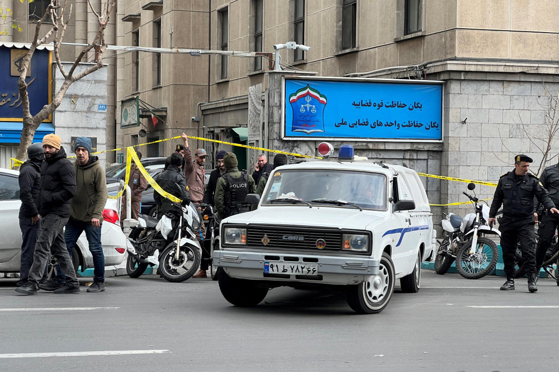 Members of the police stand in front of the judiciary building after the assassination of the Supreme Court Judges Mohammad Moghiseh and Ali Razini in Tehran, Iran, on Jan. 18. (Reuters)