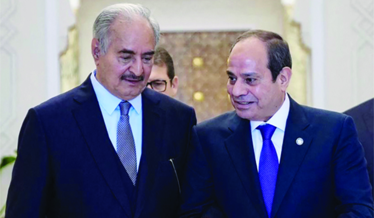 A handout picture released by the Egyptian Presidency on January 18, 2025, shows Egypt's President Abdel Fattah El-Sisi (R) receiving Libyan military strongman Khalifa Haftar in Cairo. (AFP)