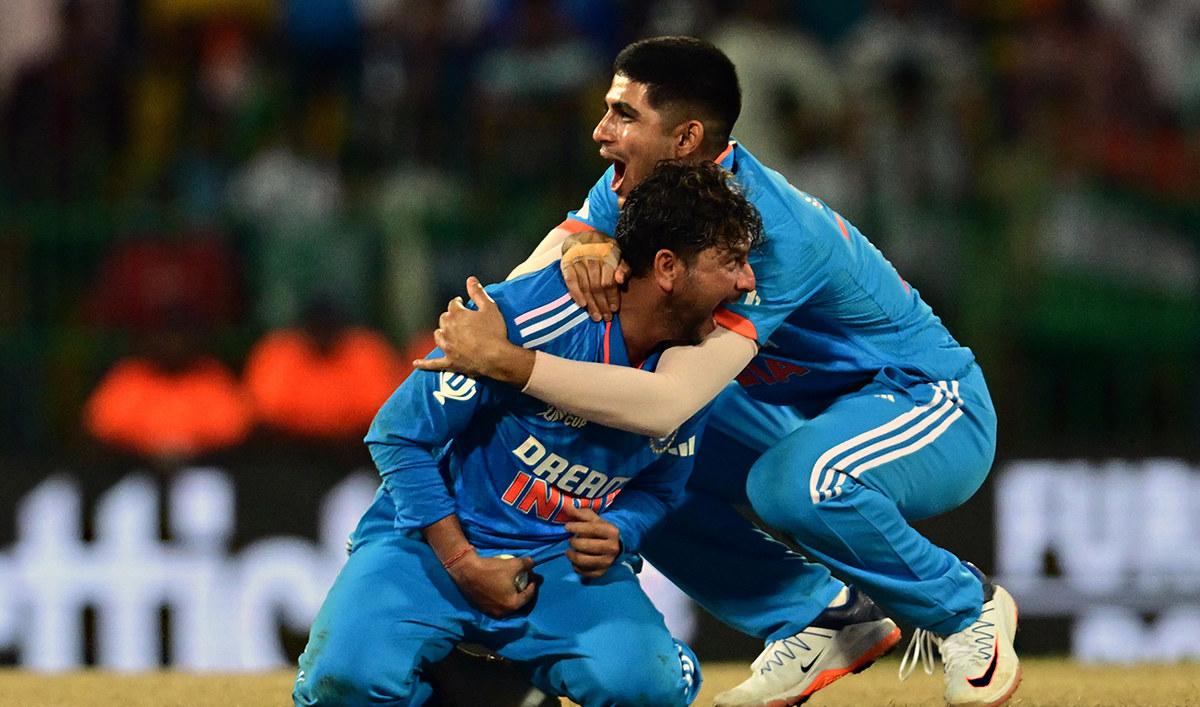 India's Kuldeep Yadav (L) and Shubman Gill celebrates after taking the wicket of Pakistan's Iftikhar Ahmed (not pictured) during the Asia Cup 2023 super four one-day international (ODI) cricket match between India and Pakistan at the R. Premadasa Stadium in Colombo on September 11, 2023. (AFP/File)