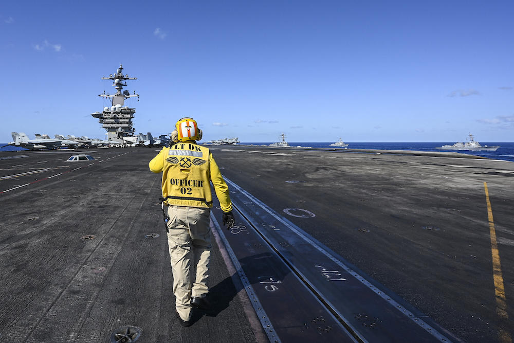 A crew member works on the deck of the USS Carl Vinson aircraft carrier during an earlier maritime exercise in the Philippine Sea on Jan. 31, 2024. (AFP file photo)