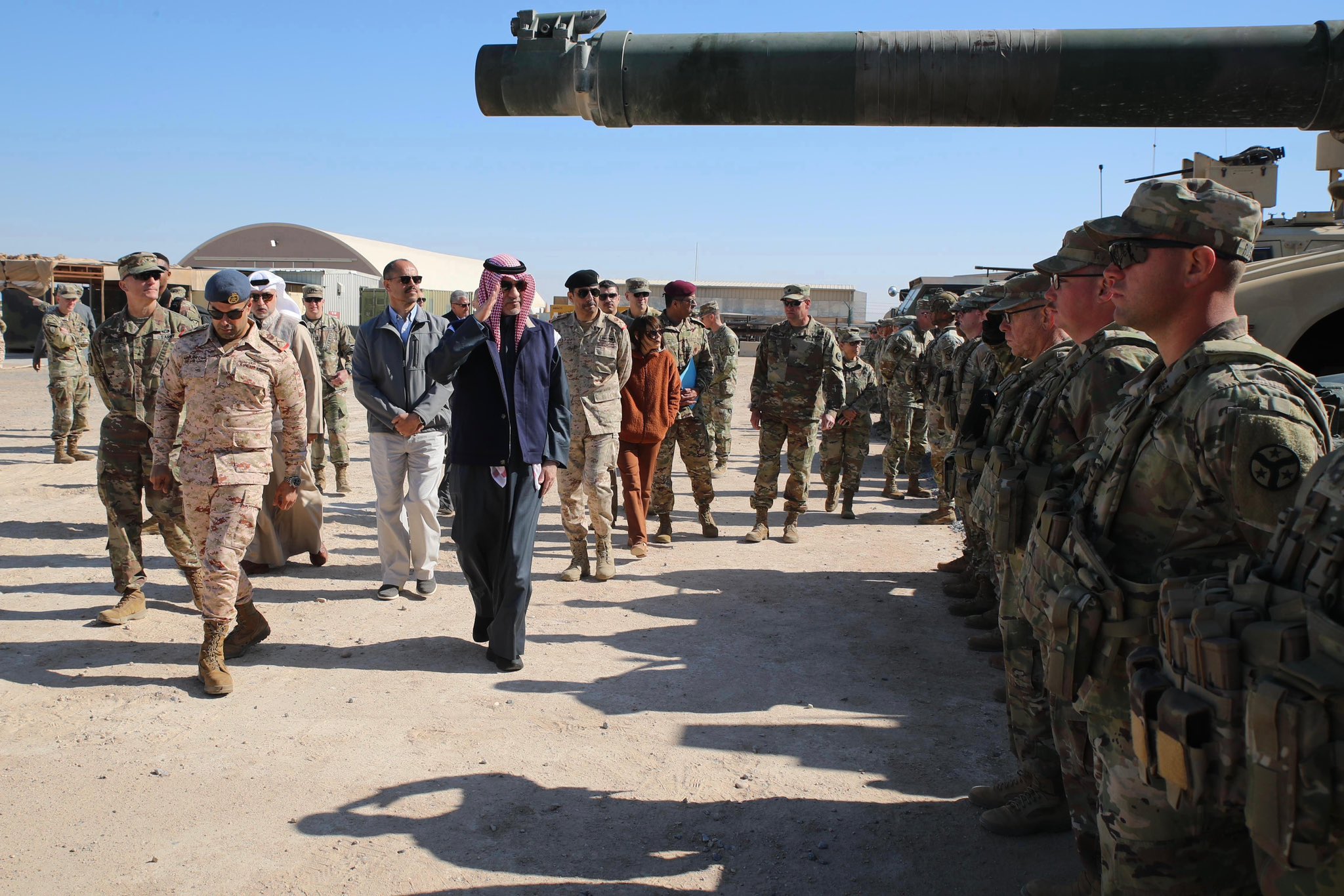 Sheikh Fahad Yusuf Saud Al-Sabah saluting troops during his visit to Camp Buehring, northwest of Kuwait, Jan. 18 (KUNA)