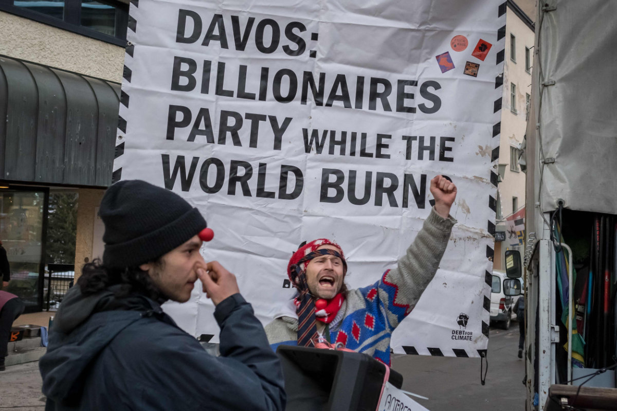 Demonstrators arrive for a protest ahead of the World Economy Forum in Davos, Switzerland, on Jan. 19, 2025. (AP)