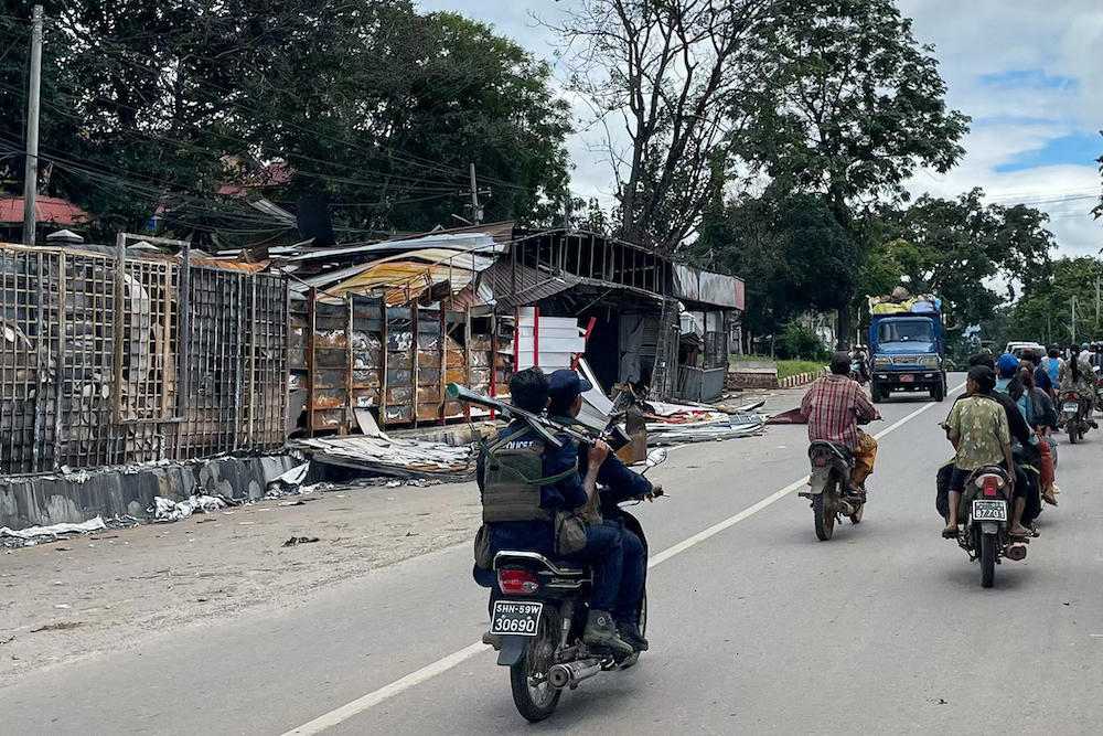 Members of the police force of the Myanmar National Democratic Alliance Army ride on a motorcycle in Lashio in Myanmar’s northern Shan State on Aug. 10, 2024. (AFP)