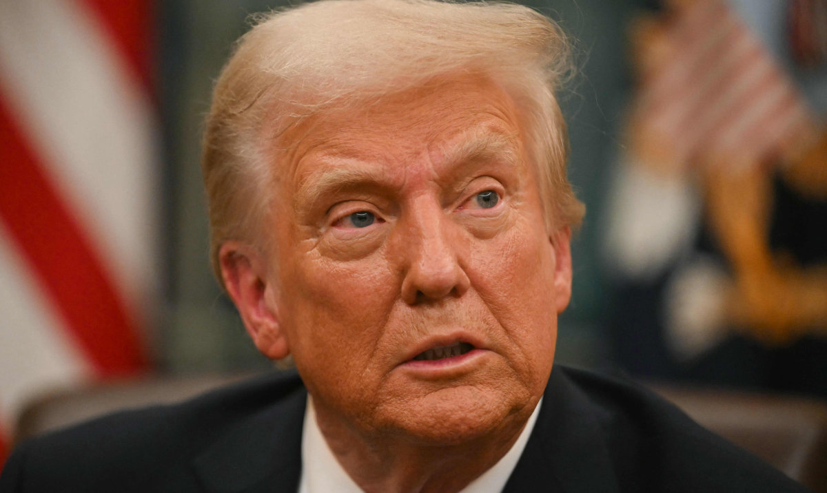 US President Donald Trump speaks to journalists as he signs executive orders in the Oval Office of the WHite House in Washington, DC, on January 20, 2025. (AFP)