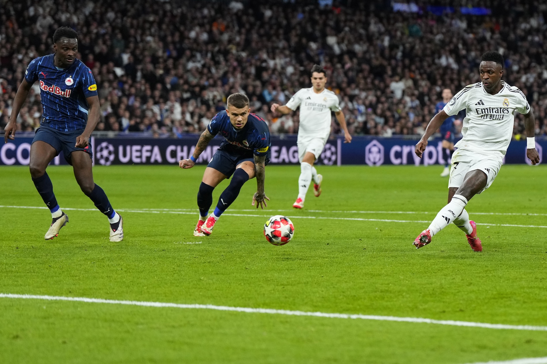 Real Madrid’s Vinicius Junior scores his side’s 5th goal during the Champions League opening phase soccer match between Real Madrid and FC Salzburg at the Santiago Bernabeu stadium in Madrid, Wednesday. (AP)