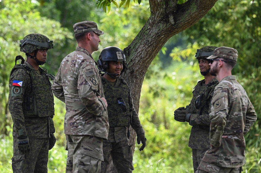 American and Filipino soldiers interact during a joint military exercise between the US and the Philippines at Laur, Nueva Ecija on Aug. 9, 2024. (AFP)