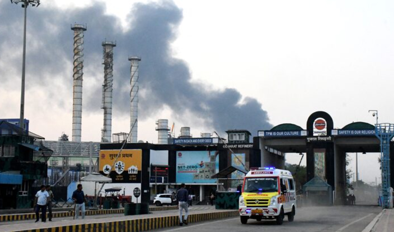 In this file photo, taken on November 11, 2024, an ambulance moves as smoke billows from an Indian Oil Corporation (IOC) refinery after a fire in Vadodara in the western state of Gujarat, India. (REUTERS/File)