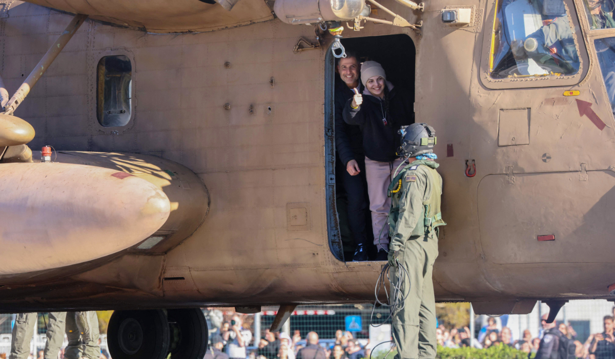 Newly released Israeli hostage Daniella Gilboa, gestures as she leaves a military helicopter upon landing at the Beilinson Hospital in Petah Tikva on January 25, 2025. (AFP)