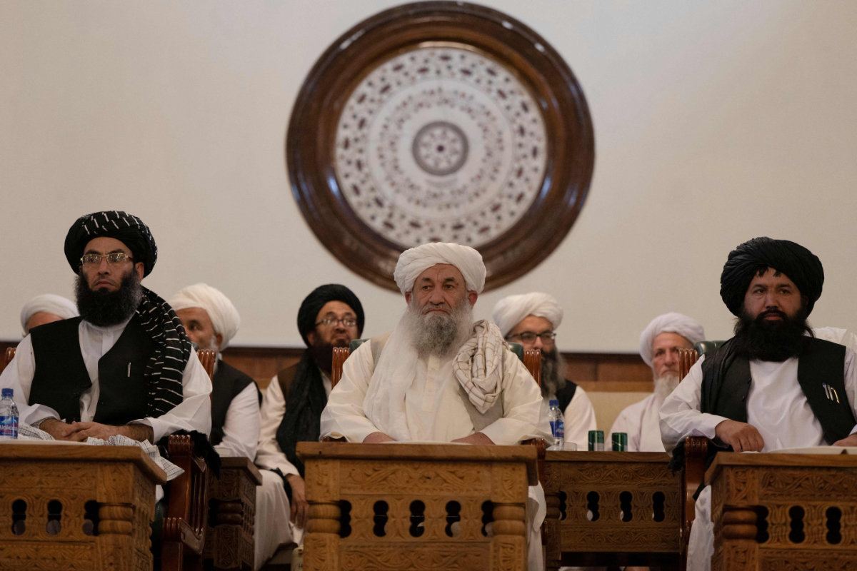 This photo taken on August 13, 2022, shows Afghanistan's Prime Minister Mohammad Hassan Akhund (C) and Minister for Promotion of Virtue and Prevention of Vice Sheikh Mohammad Khalid (L) at a gathering at the former presidential palace in Kabul. (AFP)