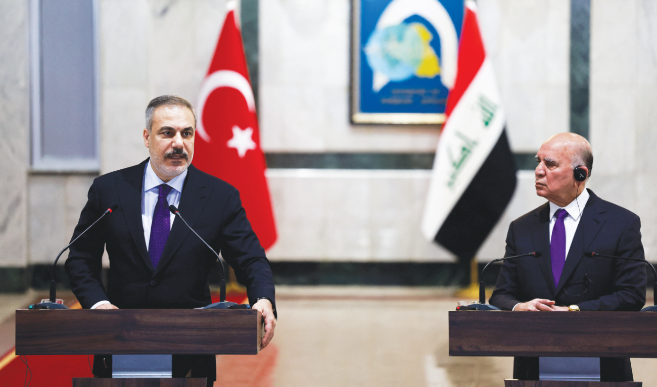 Turkish FM Hakan Fidan and and his Iraqi counterpart Fuad Hussein. (Reuters)