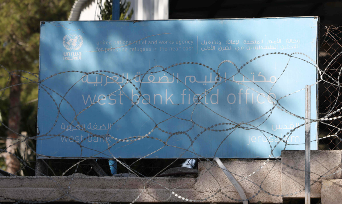 Barbed-wire covers the walls surrounding the UNRWA (United Nations Relief and Works Agency) West Bank Field Office in Jerusalem on October 29, 2024. (AFP)