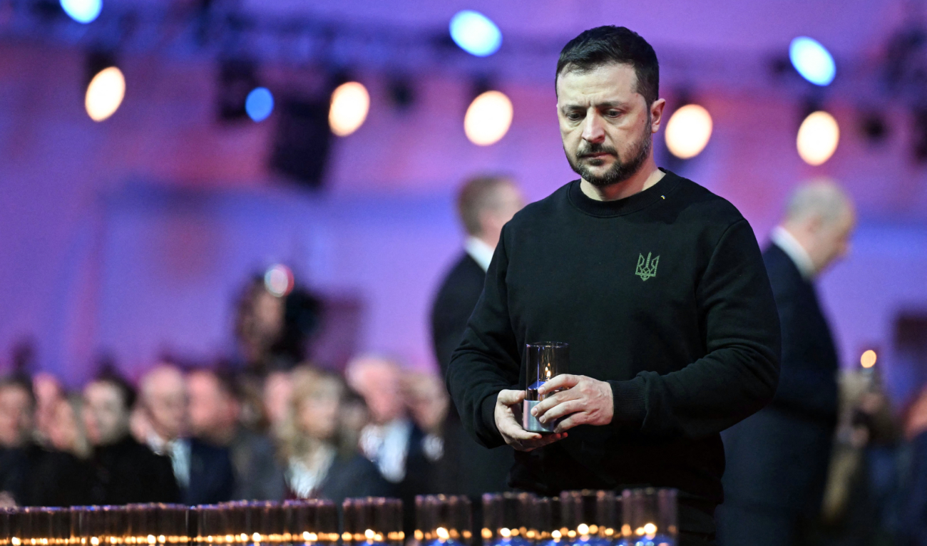Ukrainian President Volodymyr Zelensky arrives to place a votive candle in front of the train car, the symbol of the event, to pay tribute to the victims during commemorations on the 80th anniversary of the liberation of the German Nazi concentration and extermination camp Auschwitz-Birkenau by the Red Army, in Oswiecim, Poland on January 27, 2025. (AFP)