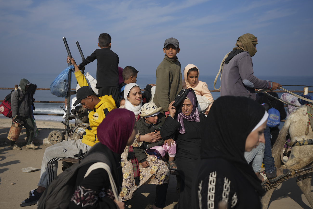 Displaced Palestinians ride in a horse-drawn cart as they return to their homes in the northern Gaza Strip, Tuesday, Jan. 28, 2025. (AP)