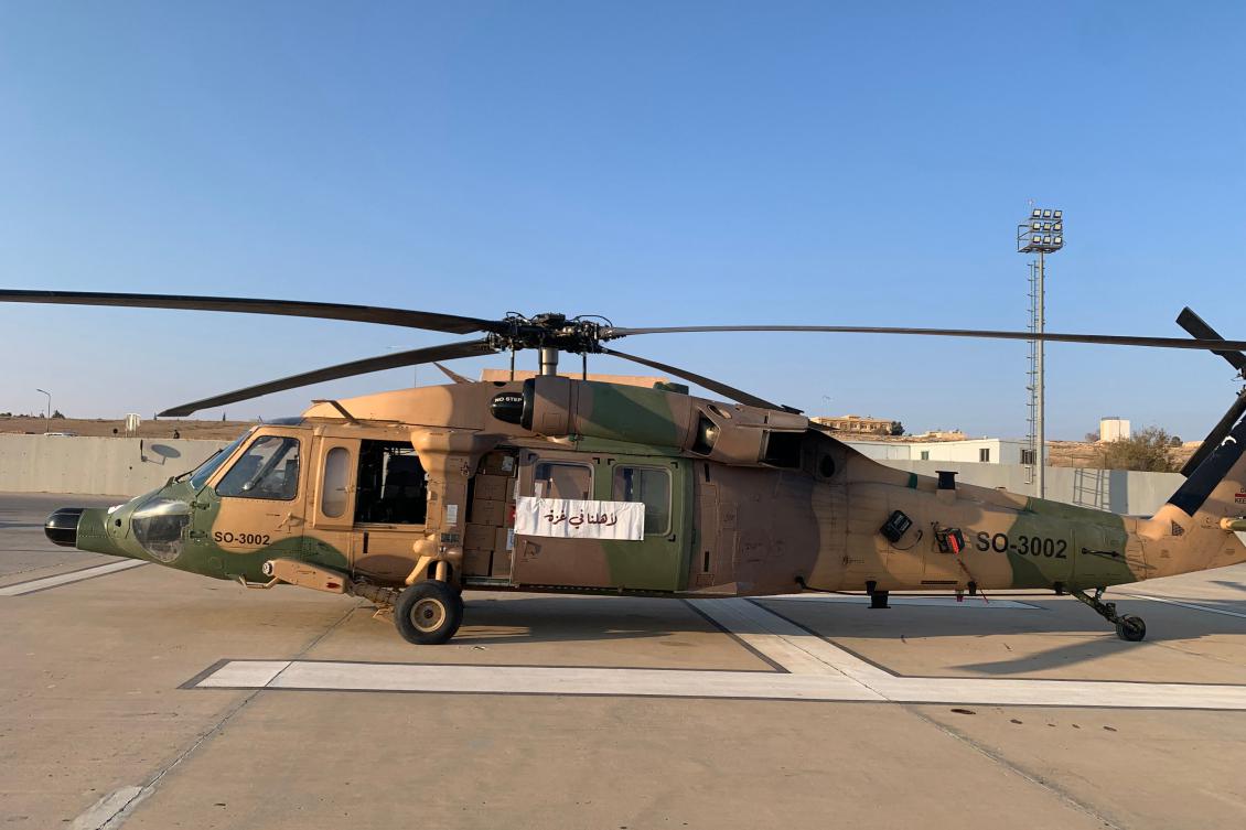 A Jordanian army helicopter transporting humanitarian aid to the Gaza Strip sits on the tarmac of an airport in Amman, Jan. 28 (AFP)
