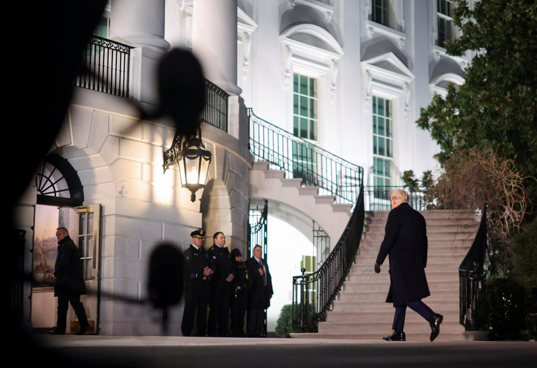 US President Donald Trump walks as he returns from Florida to the White House. (Reuters)